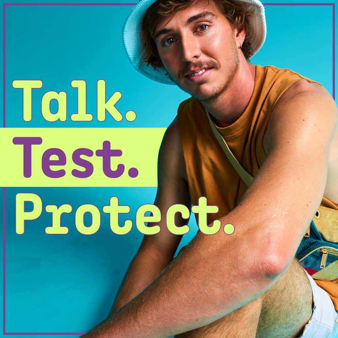 Text: Talk. Test. Protect. Image: Guy wearing a bucket hat