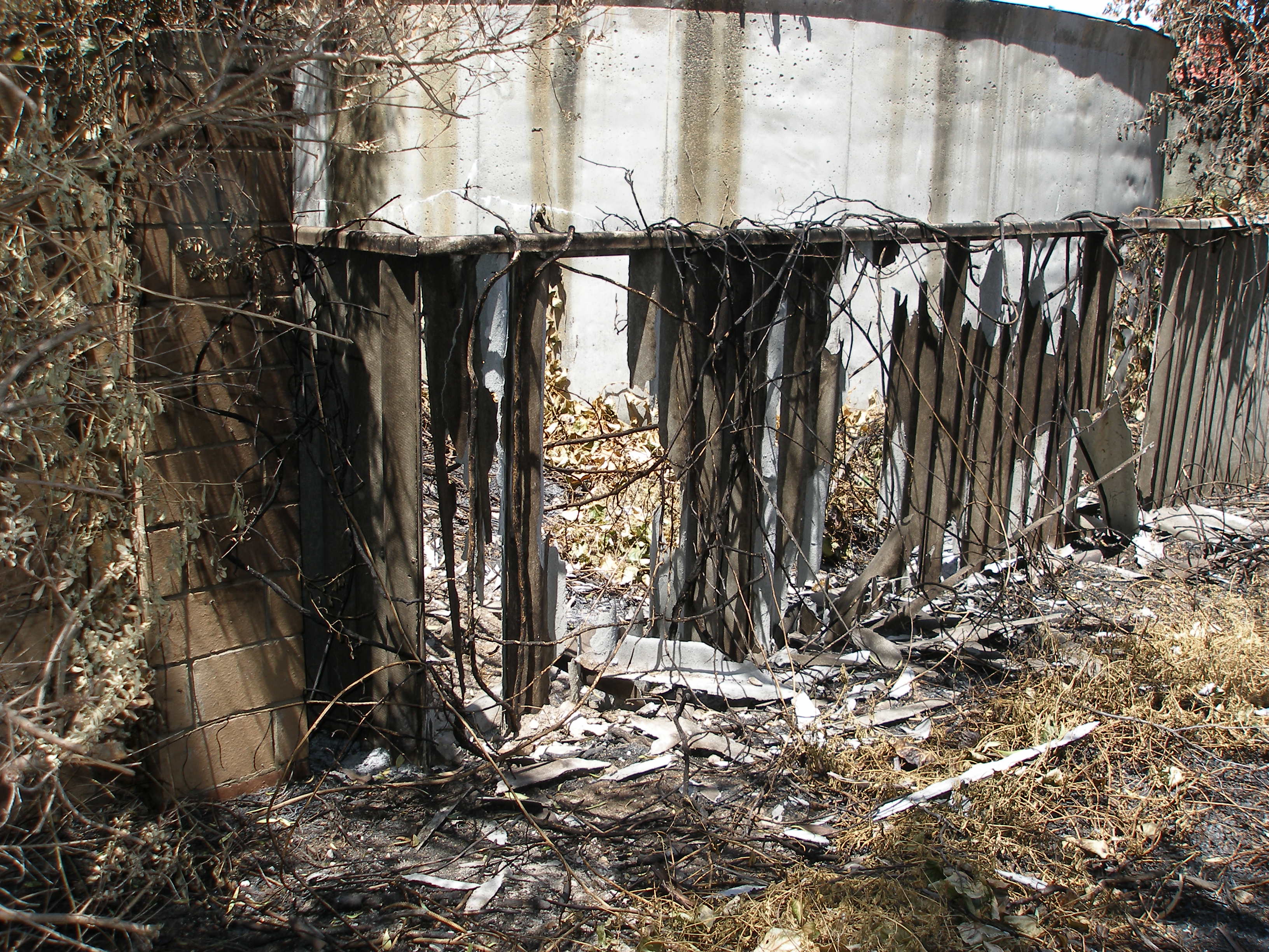 Fire damaged asbestos fence