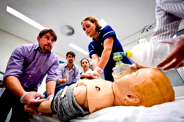 Group administering CPR on mannequin