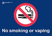Sign displaying a no smoking logo symbol featuring a line through a burning cigarette and text “Strictly no smoking past this point"