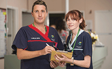 Nurses discussing patient file