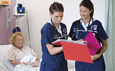 Nurses discussing patient file