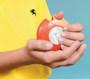 Child holding accuhaler in hands