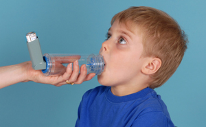 Child with lips around spacer