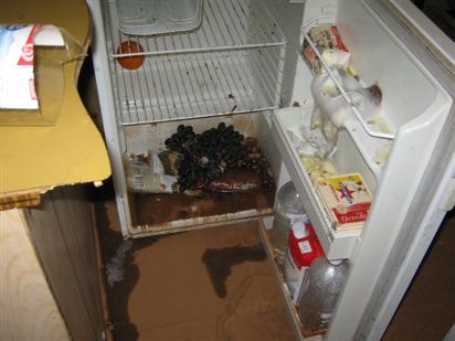 A fridge that has been damaged by floodwaters