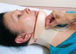 Woman putting on Philadelphia neck collar